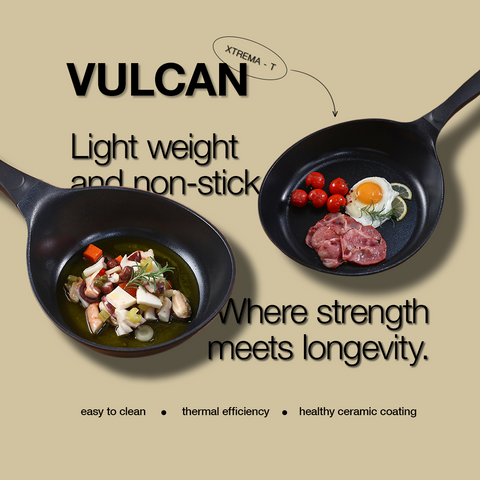 A black, lightweight non-stick VULCAN frying pan with a healthy ceramic coating and thermal efficiency, displayed with a savory stew and a separate pan with fried eggs and tomatoes, highlighting the pan's ease of cleaning and durability