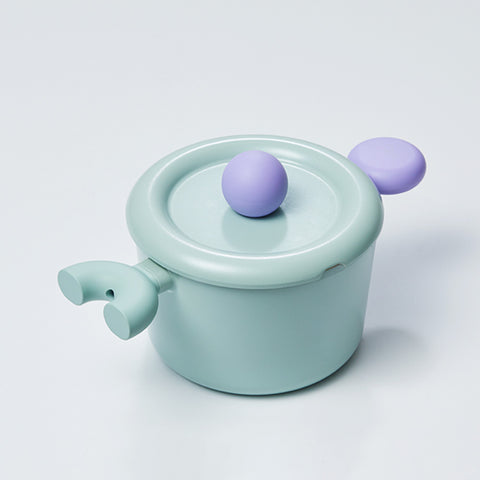 A pastel-colored pot with a light green body and a purple handle and lid, displayed on a white background