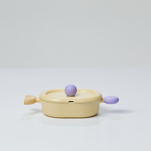 A yellow oval pot with a lid and purple handles, displayed on a white background.