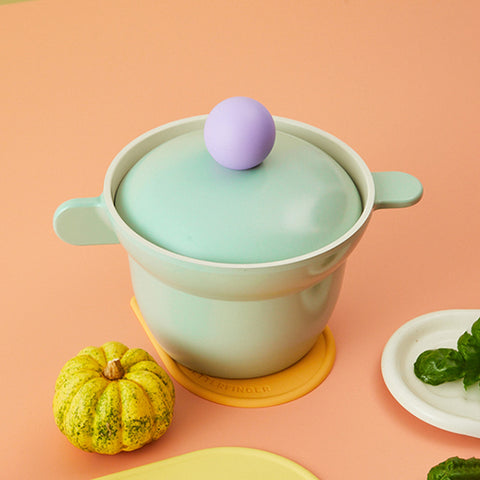 Versatile modern pastel mint rice pot with a purple knob, ceramic rice cooker, aesthetic kitchenware, paired with a small decorative pumpkin."

Keywords: rice cooker, ceramic pot, pastel kitchenware, aesthetic home decor, rice pot recommendation
