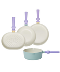 A set of four pastel-colored cookware pieces, including an oval grill pan, two frying pans, and a small pot with light green bodies and purple handles, displayed on a white background