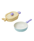 A set of two pastel-colored cookware items, including a yellow oval pot with a lid and a light green frying pan, both with purple handles, displayed on a white background