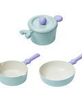 A set of three pastel-colored cookware items, including a light green pot with a lid, a light green saucepan, and a light green frying pan, all with purple handles, displayed on a white backgroun