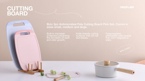 Antimicrobial poly cutting boards in a BiJu 3pc set, shown in pink, blue, and cream, featuring microban protection, knife-friendly surfaces, and BPA-free construction, presented with the cutting boards in use, indicating their practicality and safety for food preparation.