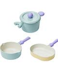 A set of three pastel-colored cookware items, including a light green pot with a lid, a light green saucepan, and a yellow grill pan, all with purple handles, displayed on a white background