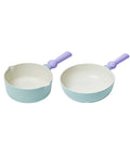 A set of two pastel-colored cookware items, including a light green saucepan and a light green frying pan, both with purple handles, displayed on a white background